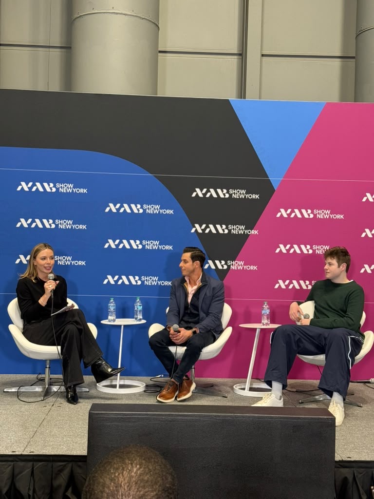 Anne Singer speaking with two fellow panelists on the NAB Show New York stage